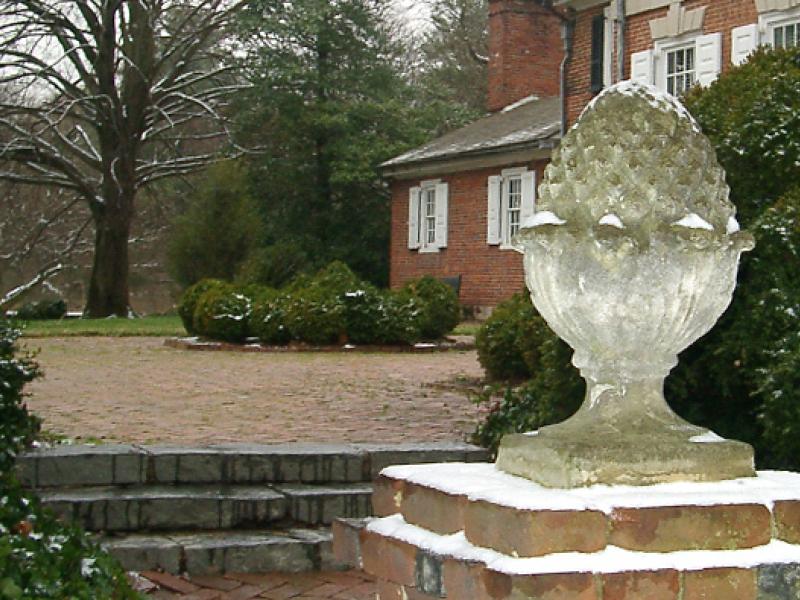 Colonial Revival style garden pineapple gate ornament at the entry of the Corbit-Sharp House
