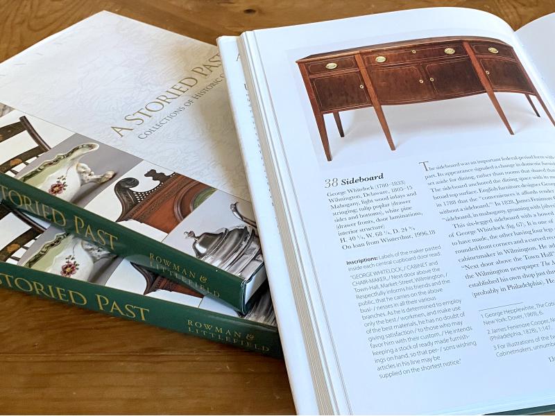 A Storied Past stack of books with one open