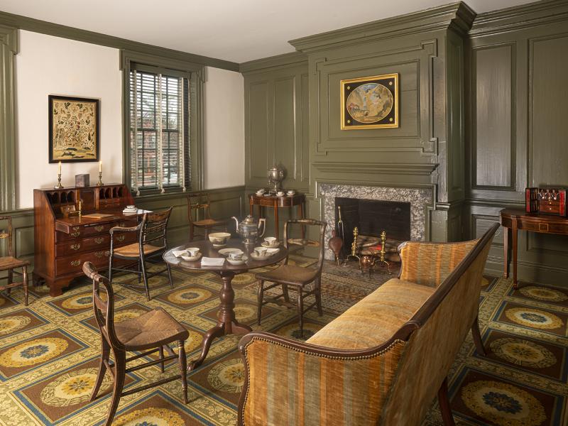 Parlor in the Wilson-Warner house with couch and setting for tea
