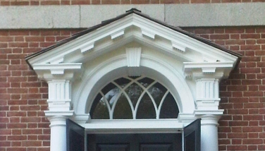 Georgian houses displayed a strict symmetry with a paneled door as a centerpiece capped by an elaborate crown or pediment.