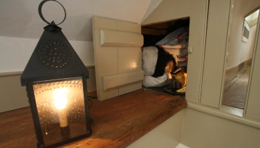 Runnaway slave Sam hides in the attic of the Corbit-Sharp House